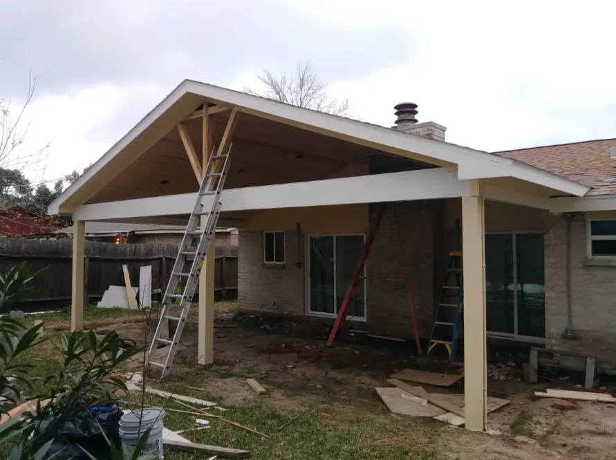 New patio cover framed and trimmed, ladder still in place