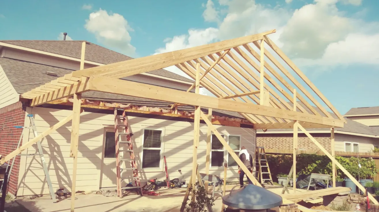 Barrantes crew framing a gable patio cover off the back of a Houston home