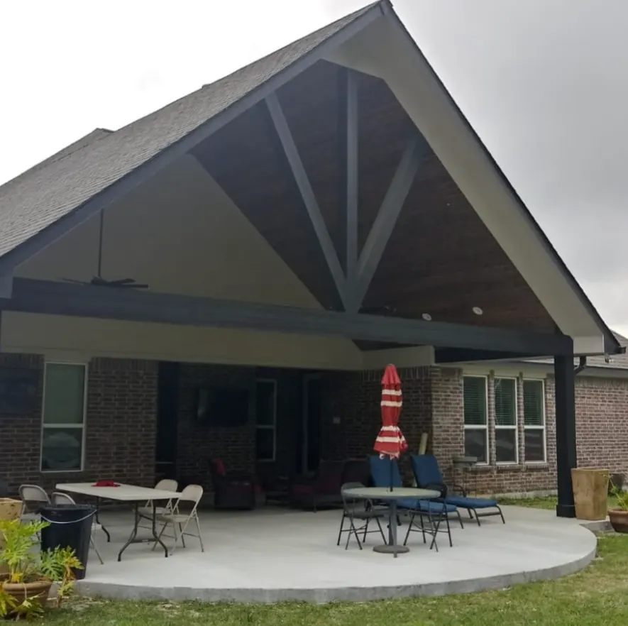 Finished gable patio cover over a curved concrete patio
